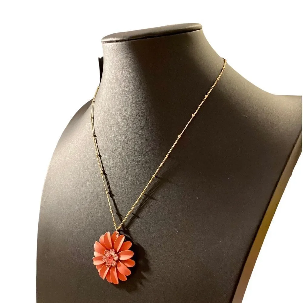 Beautiful Orange Flower Necklace on a delicate looking gold toned chain.
